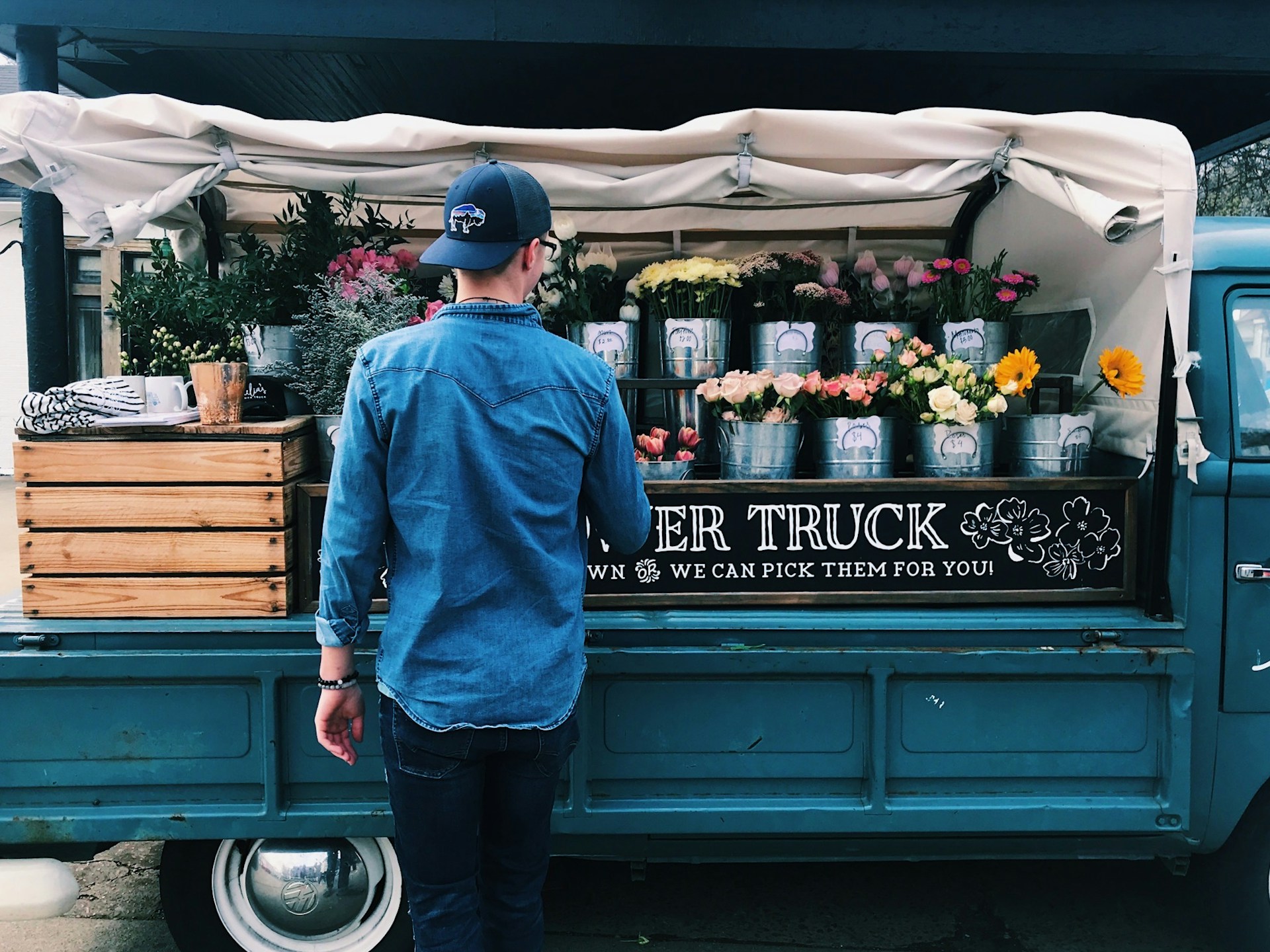 man facing flower truck