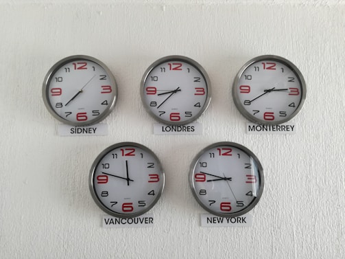 five assorted country wall clocks