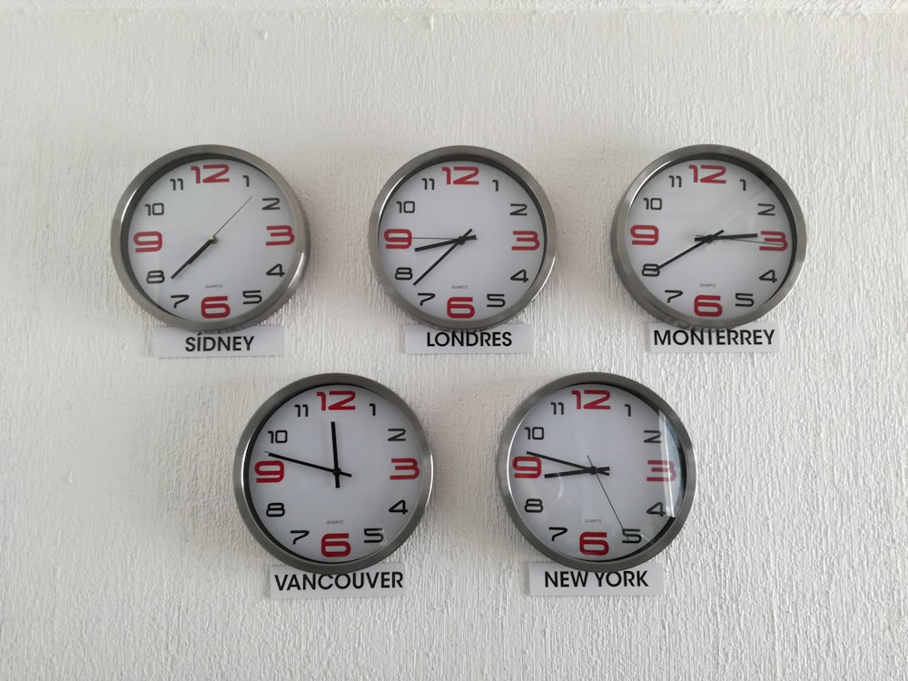 five assorted country wall clocks