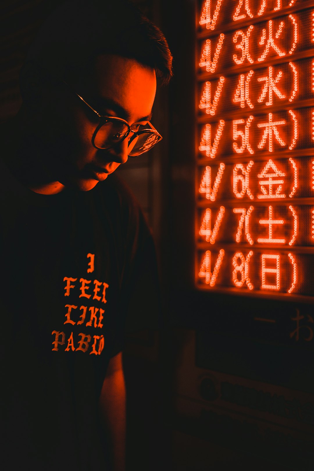 man standing near LED signage