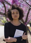 woman hugging book