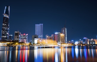 city buildings beside body of water
