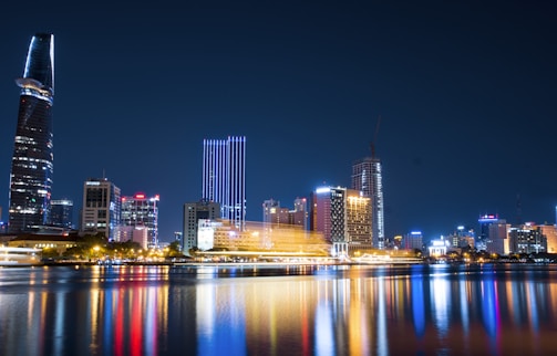 city buildings beside body of water