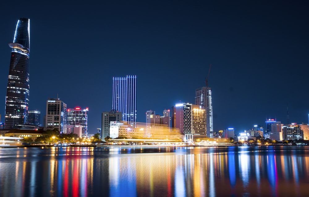 city buildings beside body of water