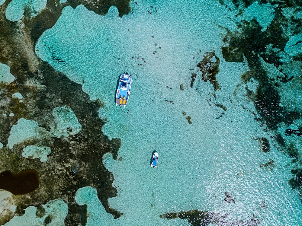 aerial photo of a boat on the body of water