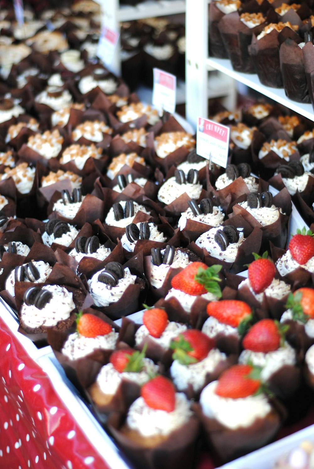 chocolate cupcakes with strawberries and cookies