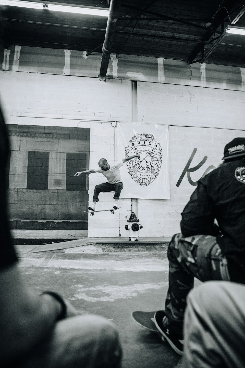 man riding skateboard near door