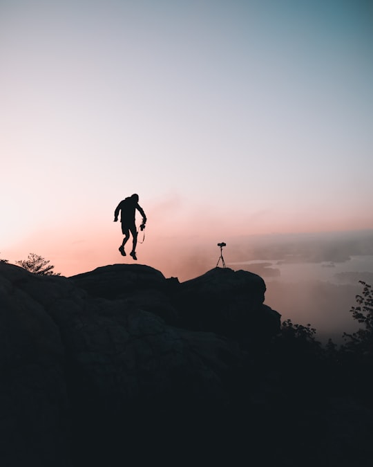 man jumping near cliff in Alabama United States