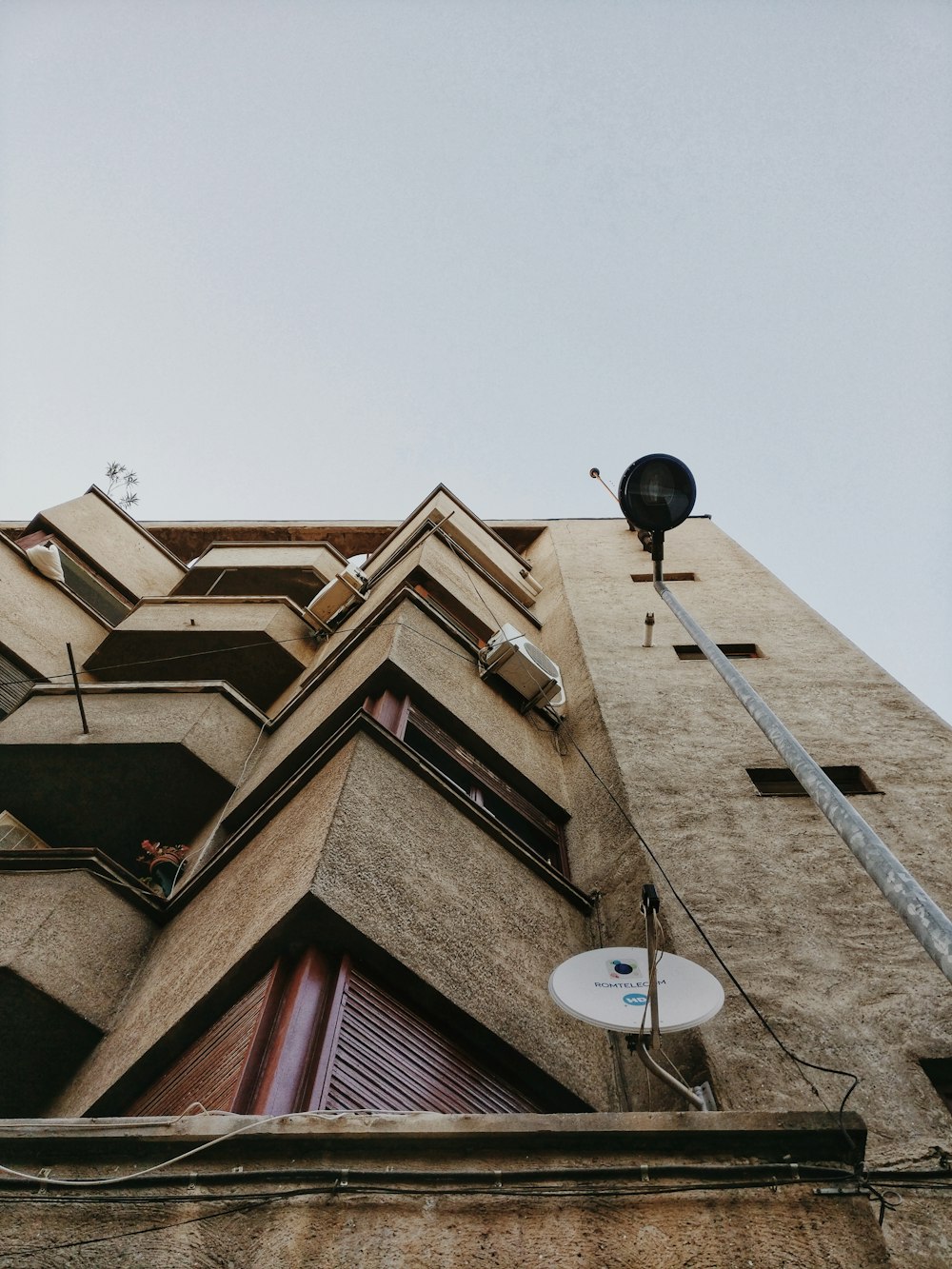 brown concrete building near lamppost