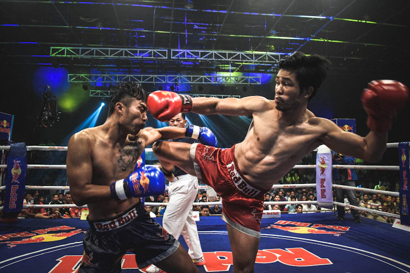 Trained Muay Thai fighter landing a kick in competition