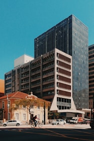 man ridding a bicycle on cossing