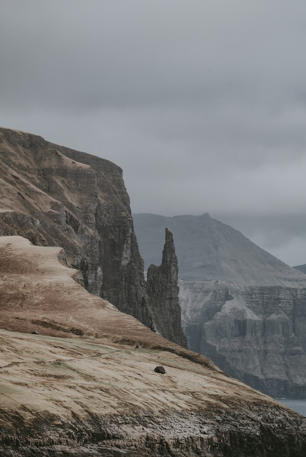 mountain beside body of water