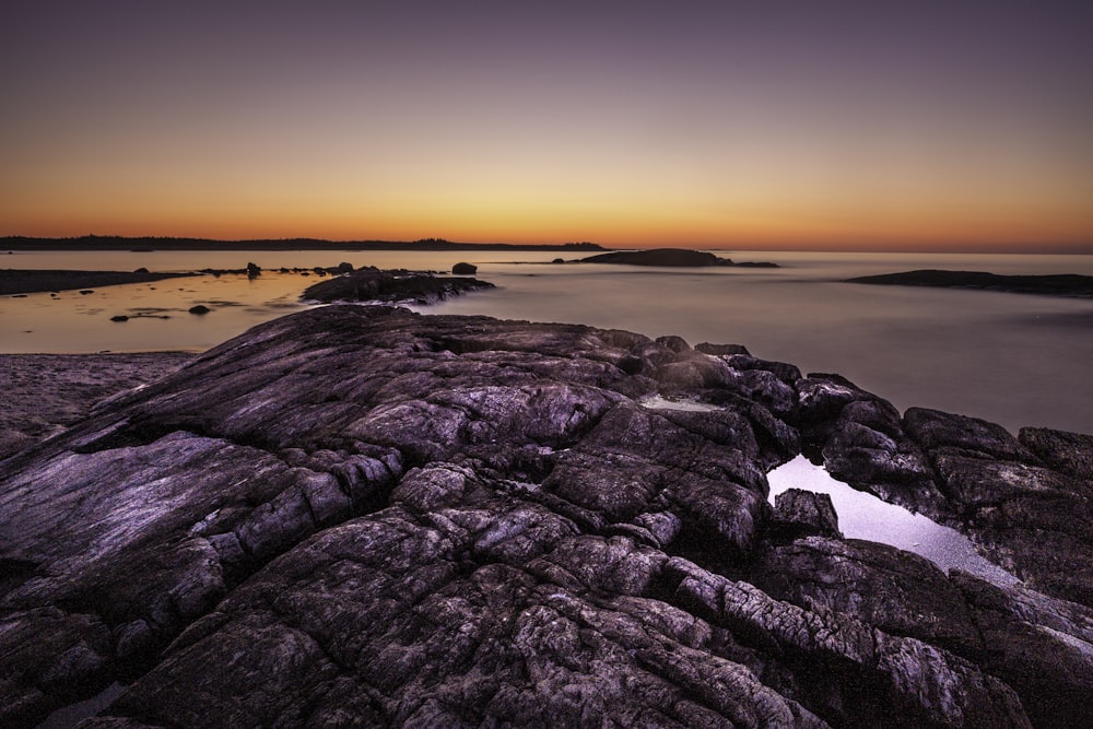 gray rock formation above sky