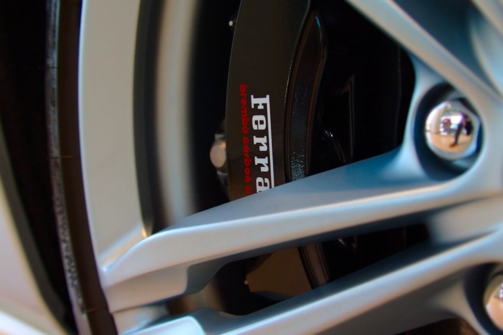 closeup photography of gray vehicle wheel and tire