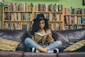 woman reading a book while sitting on black leather 3-seat couch