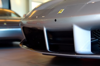 Close-up of a cosmetic repair being carefully applied to a car bumper.