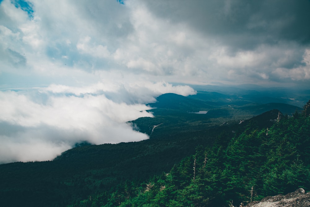 green mountains under white clouds during daytime