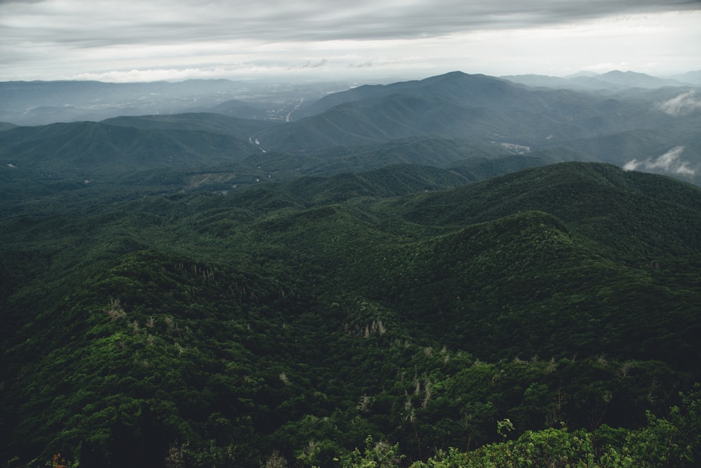 green mountains under white clouds during daytime