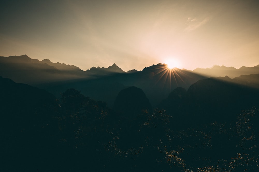 silhouette of mountains during sunset