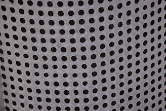 Close-up photo of a sturdy GI perforated cable tray with visible ventilation holes.
