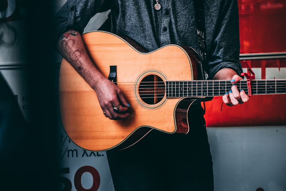 man using guitar