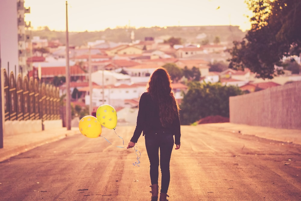 woman holding balloon