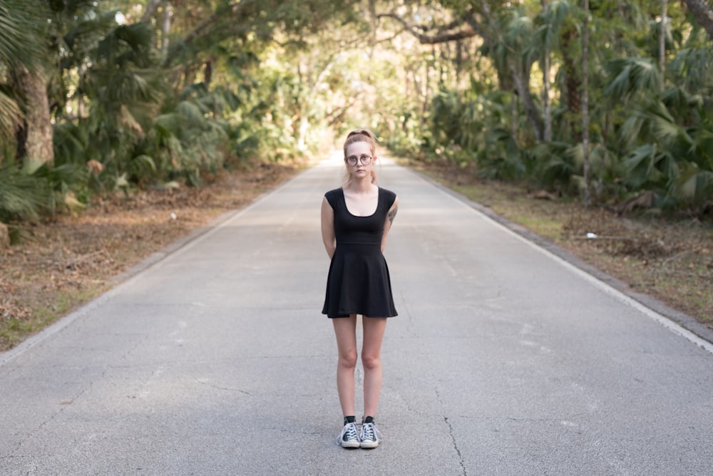 woman standing in the middle of the road