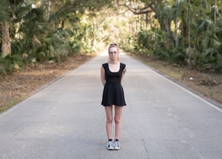 woman standing in the middle of the road