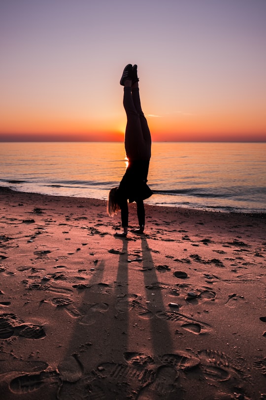 person near body of water during golden hour in Rågeleje Denmark