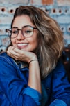 closeup photo of woman wearing black framed eyeglasses
