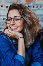 closeup photo of woman wearing black framed eyeglasses