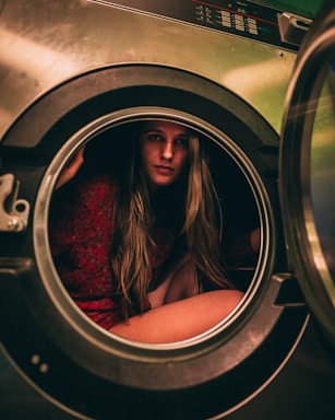 A friendly customer service representative wearing a headset, ready to assist with washing machine inquiries.