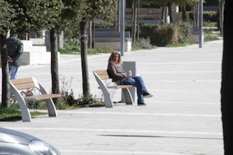 An urbanecho speaker on a park bench with a person jogging nearby, capturing the spirit of active city living.