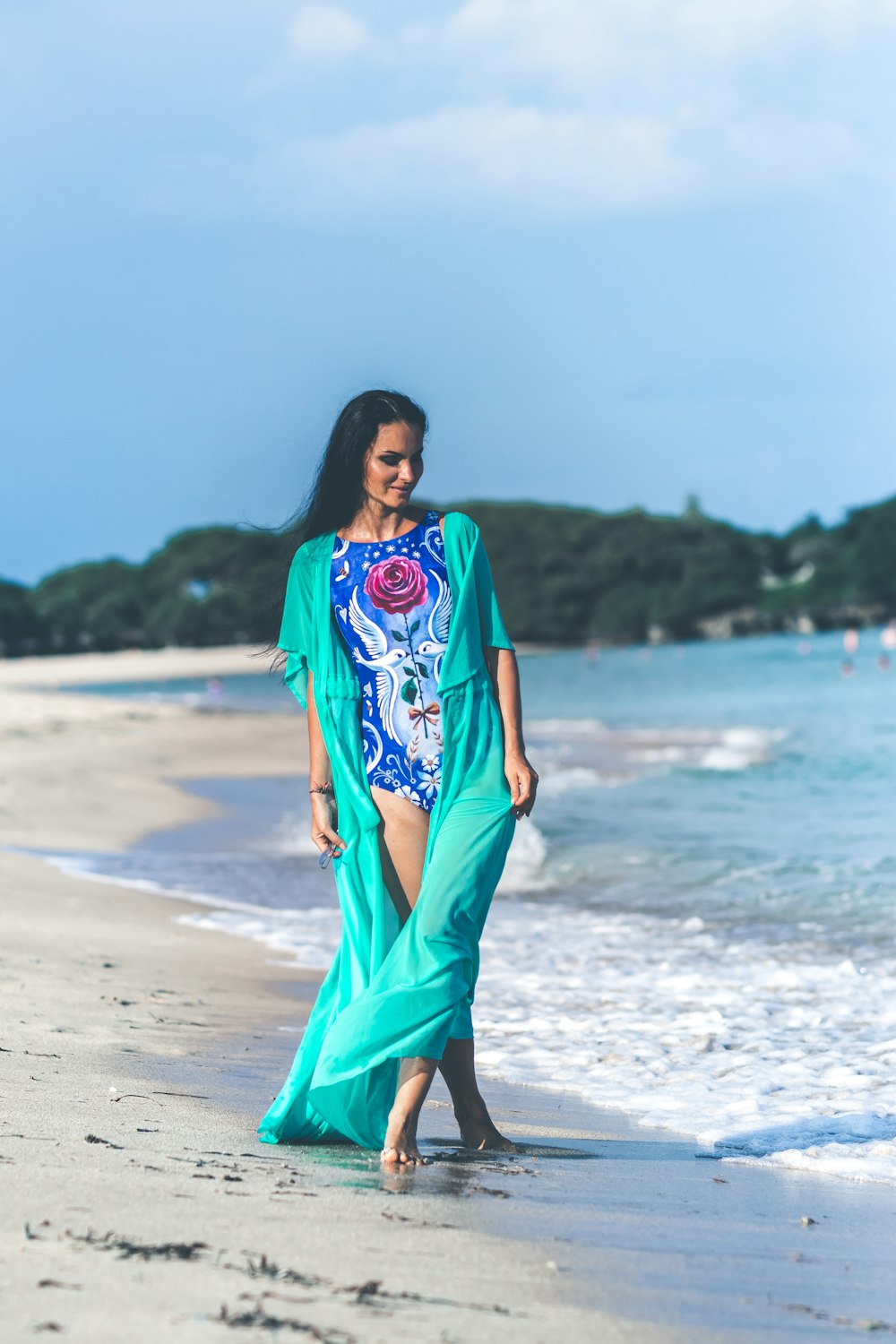 woman walking in the beach during daytime