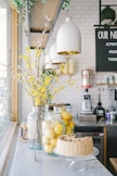 baked cake near lemon fruits in glass container in a kitchen