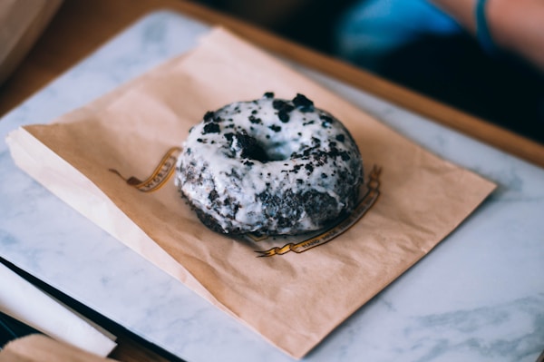 Cookies and cream donuts on brown paper