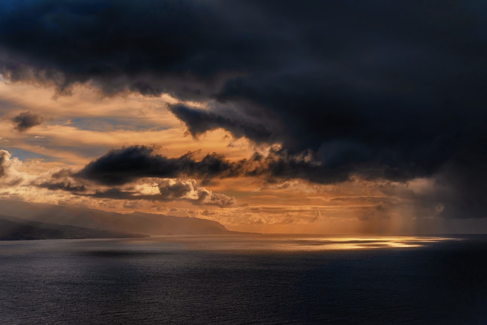 photo of body of water during golden hour