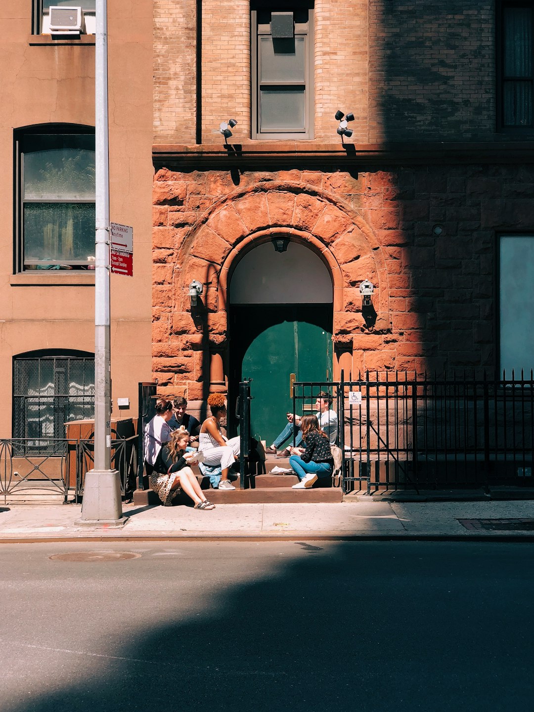 people sitting in front of door