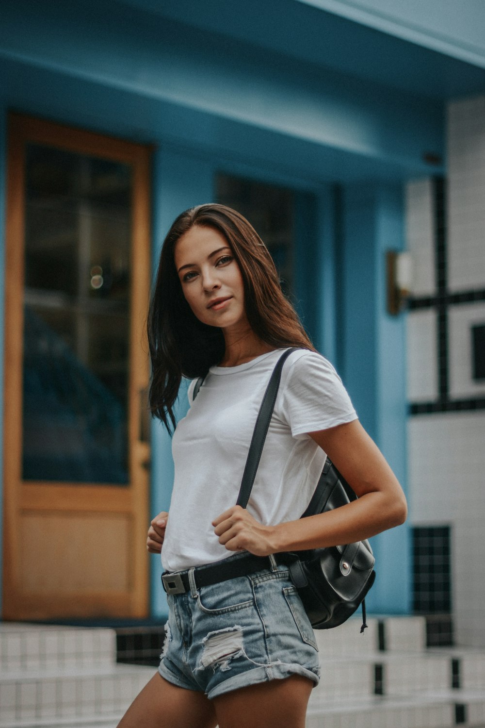 woman in white shirt standing