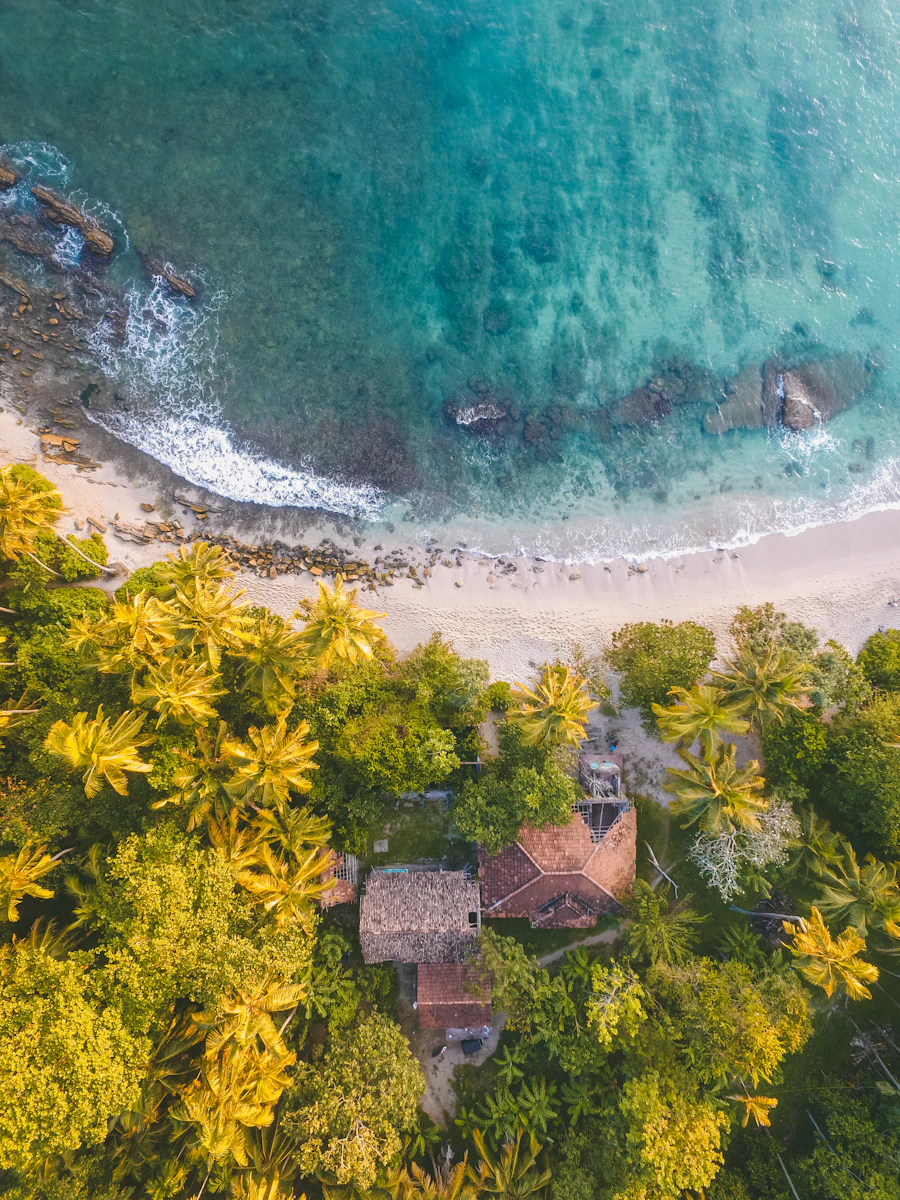 Aerial view of shallow turquoise water at a calm bay