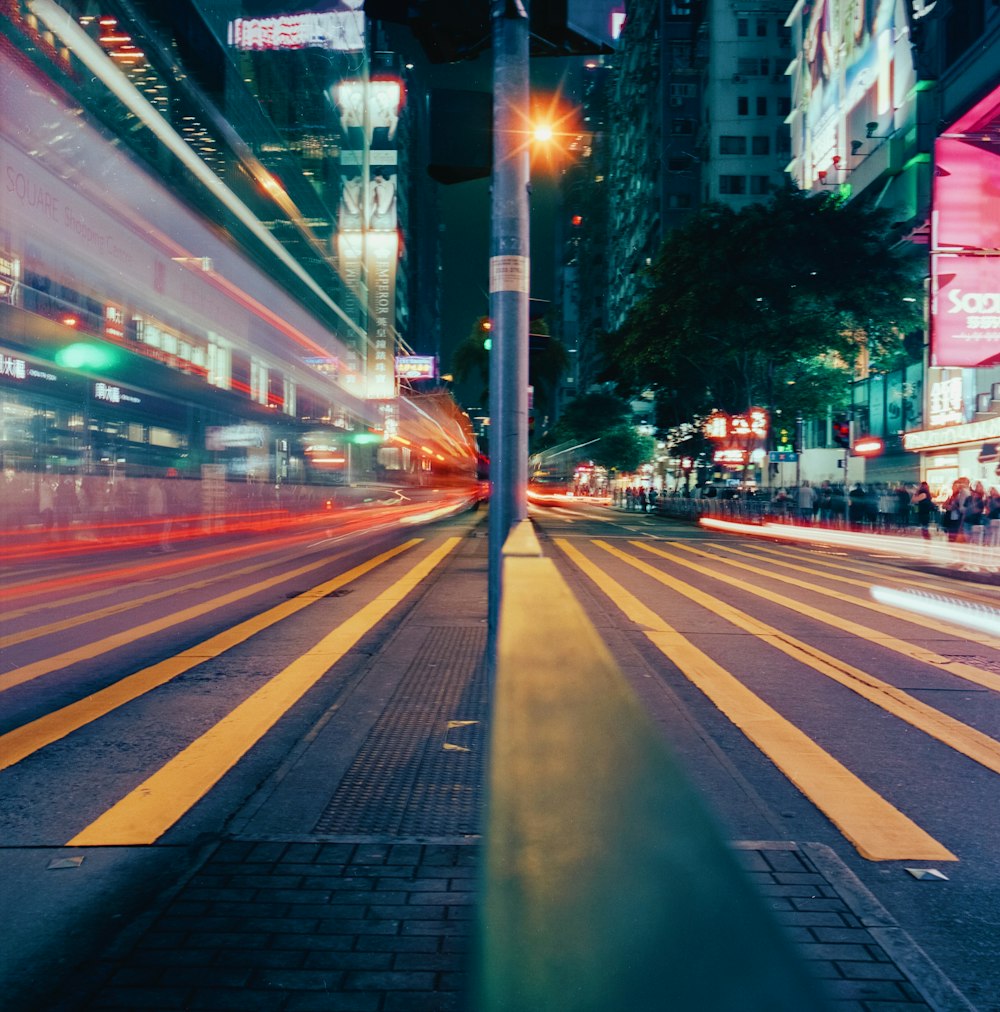 empty road near buildings during nighttime