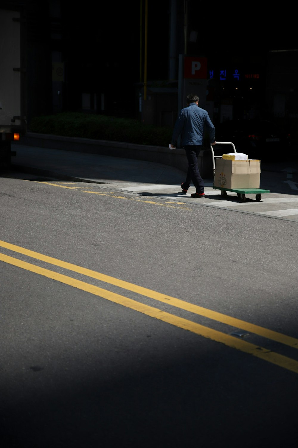 man pulling trolley