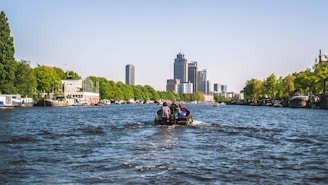 A scenic view of a river with tourists enjoying a boat ride.