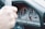 Close-up of a taxi meter and steering wheel inside a car.