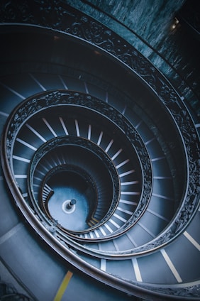 closeup photo of black spiral stairs