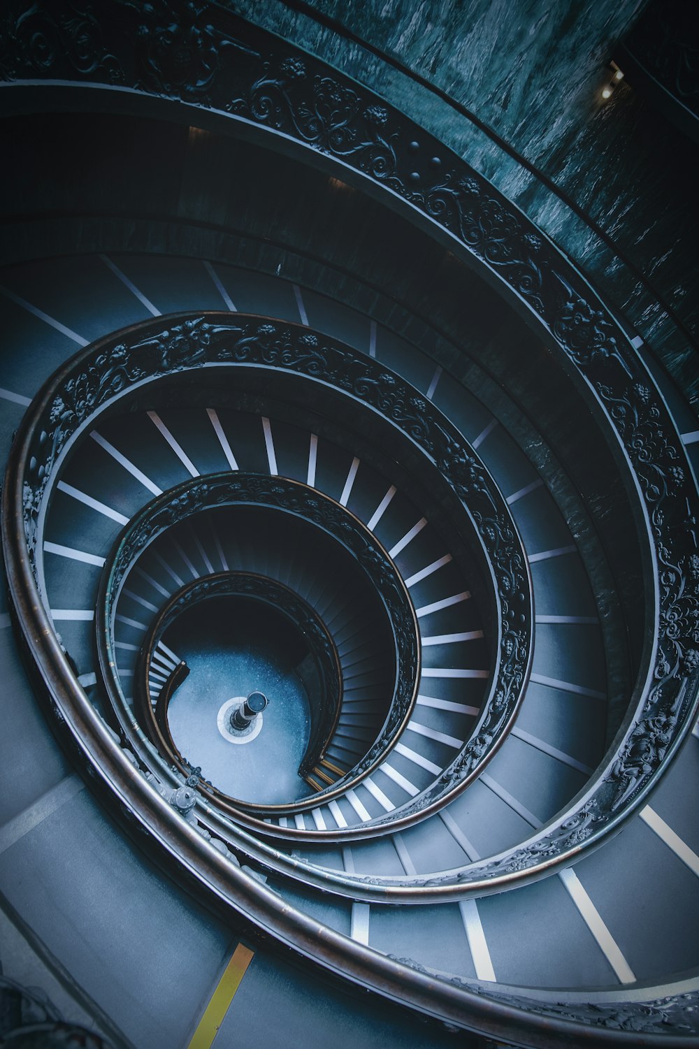 closeup photo of black spiral stairs