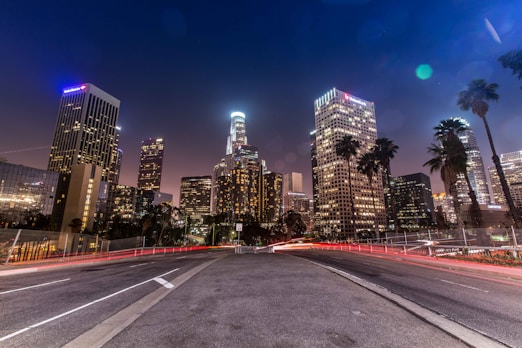 timelapse photo of busy road near buildings