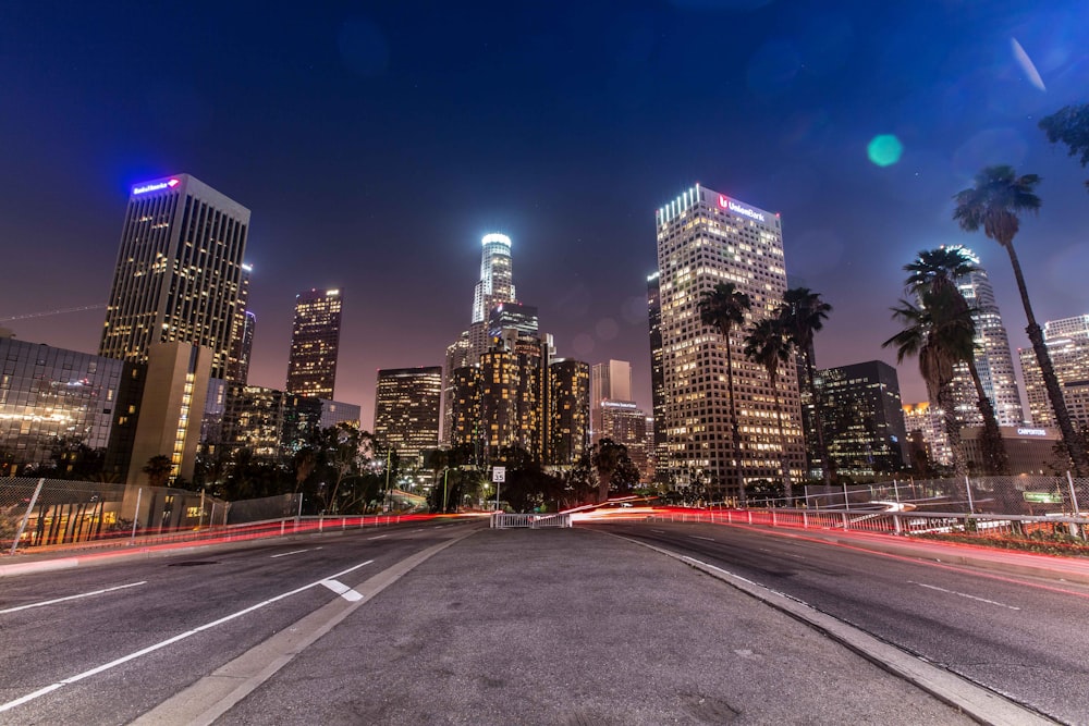 timelapse photo of busy road near buildings