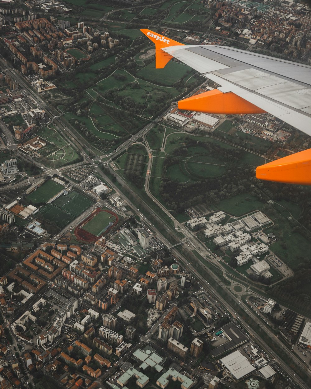 person showing gray and white airplane wings