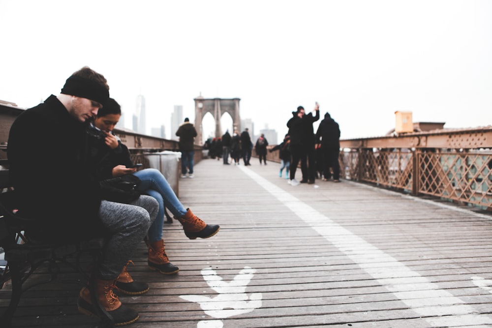 people sitting and walking on dock